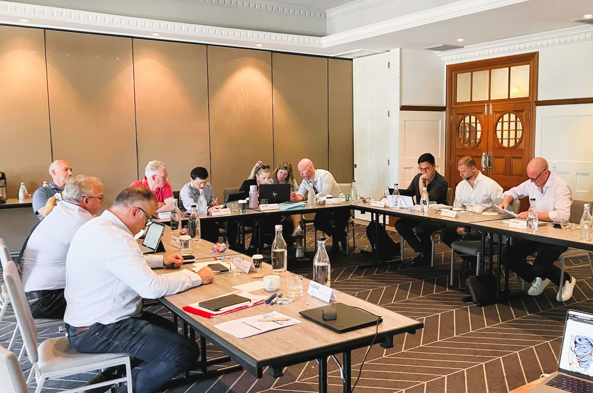 Vistage group deep in a live simulation session